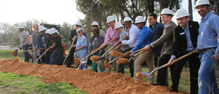 Group of people digging with shovels